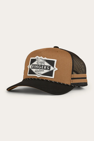 The Ringers Western Hometown Trucker Cap features a brown and black design with a curved black brim, mesh back, adjustable snapback, decorative rope, and a bold front patch showcasing "Ringers Western" and a bull.