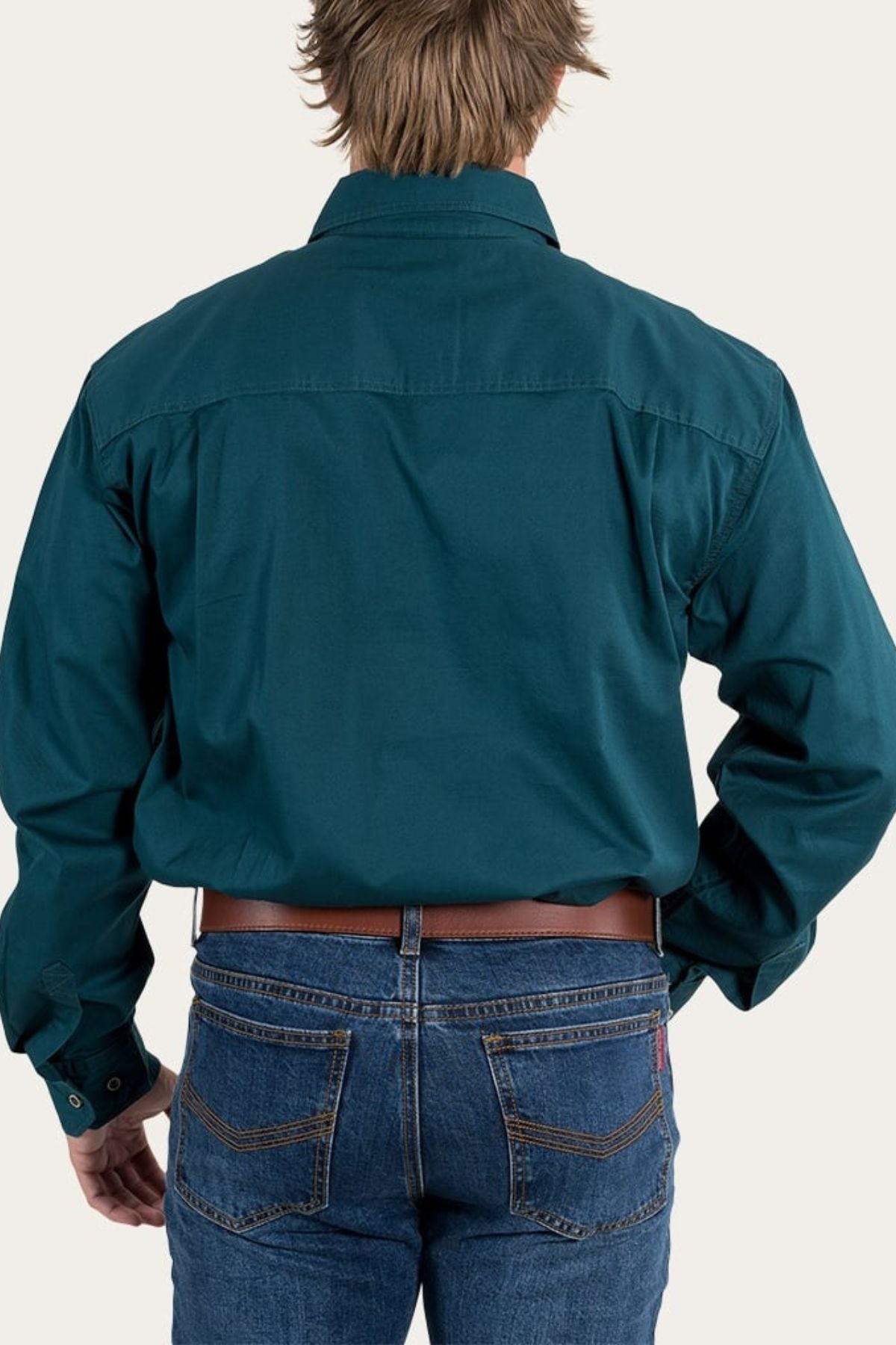 A person in a teal Ringers Western King River Half Button Shirt and blue jeans, viewed from behind against a plain light background.