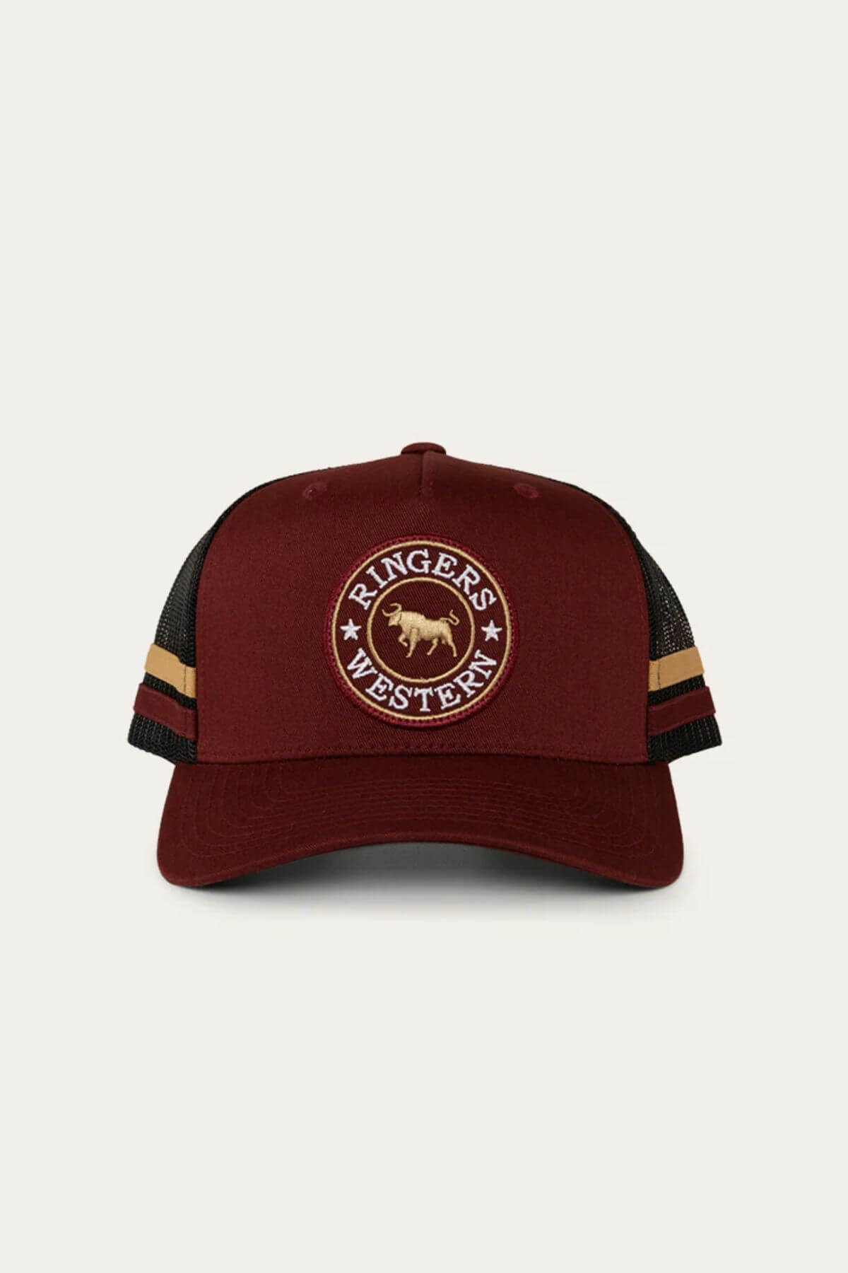 The Ringers Western McCoy Trucker Cap is a maroon cotton twill hat with a mesh back, a circular "Ringers Western" patch and bull logo on the front, plus brown and yellow stripes on the sides.