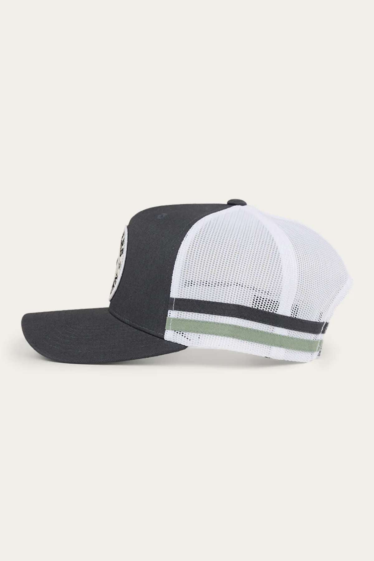 A side view of the Ringers Western McCoy Trucker Cap showcasing its dark grey cotton twill front panel, white mesh back with two horizontal green and white stripes, black brim, and adjustable snapback closure.