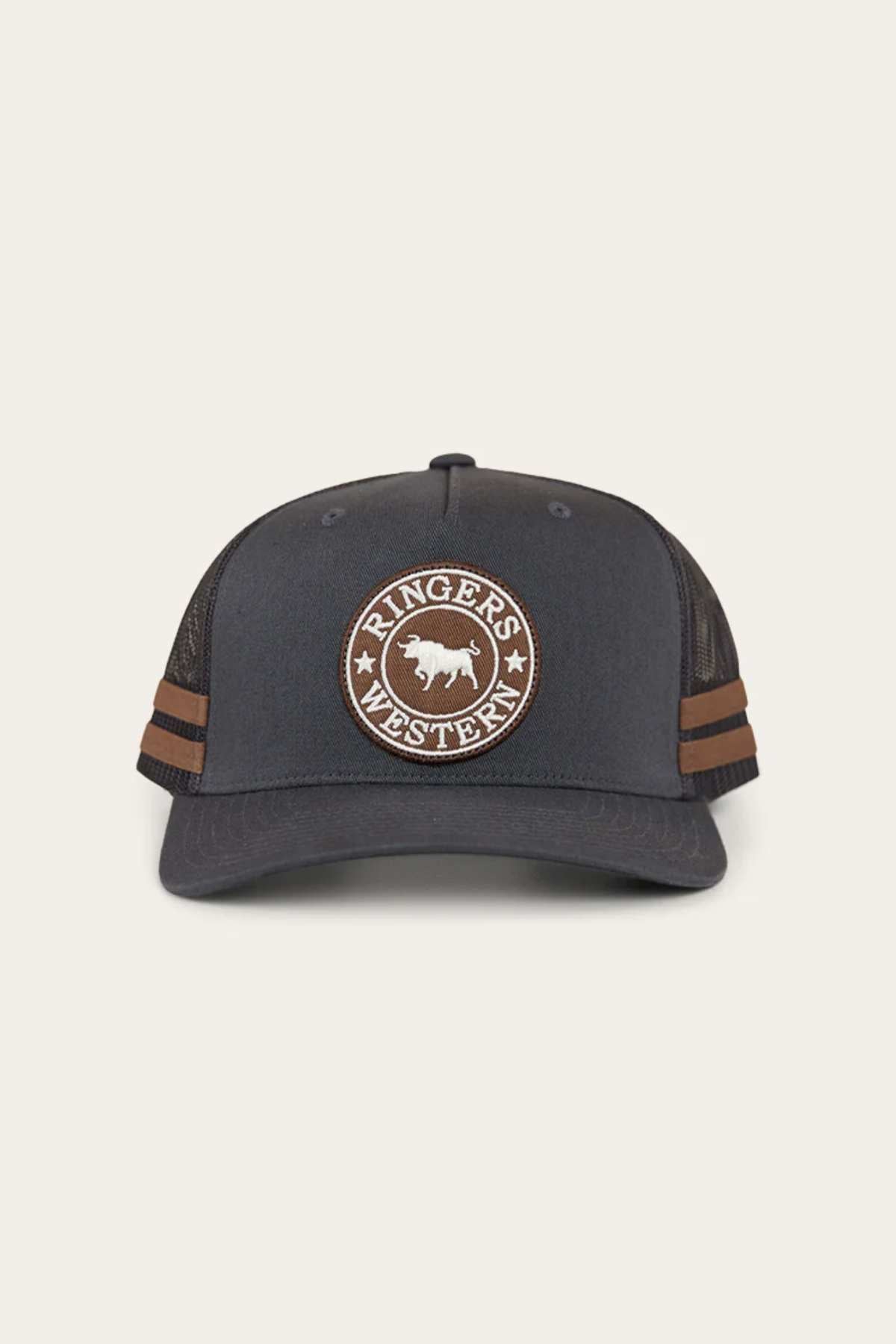 The Ringers Western McCoy Trucker Cap is black with a mesh back, two brown side stripes, and a front patch displaying "Ringer's Western" encircling a cow silhouette on a light green background.
