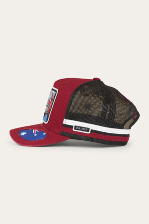 Side view of a Ringers Western Mud Sweat Beers Deep Fit Trucker Cap in red and black with mesh back, white and black stripes, "Est. 2012" patch on the back, and an Australian flag under the brim. Combines comfort and style.