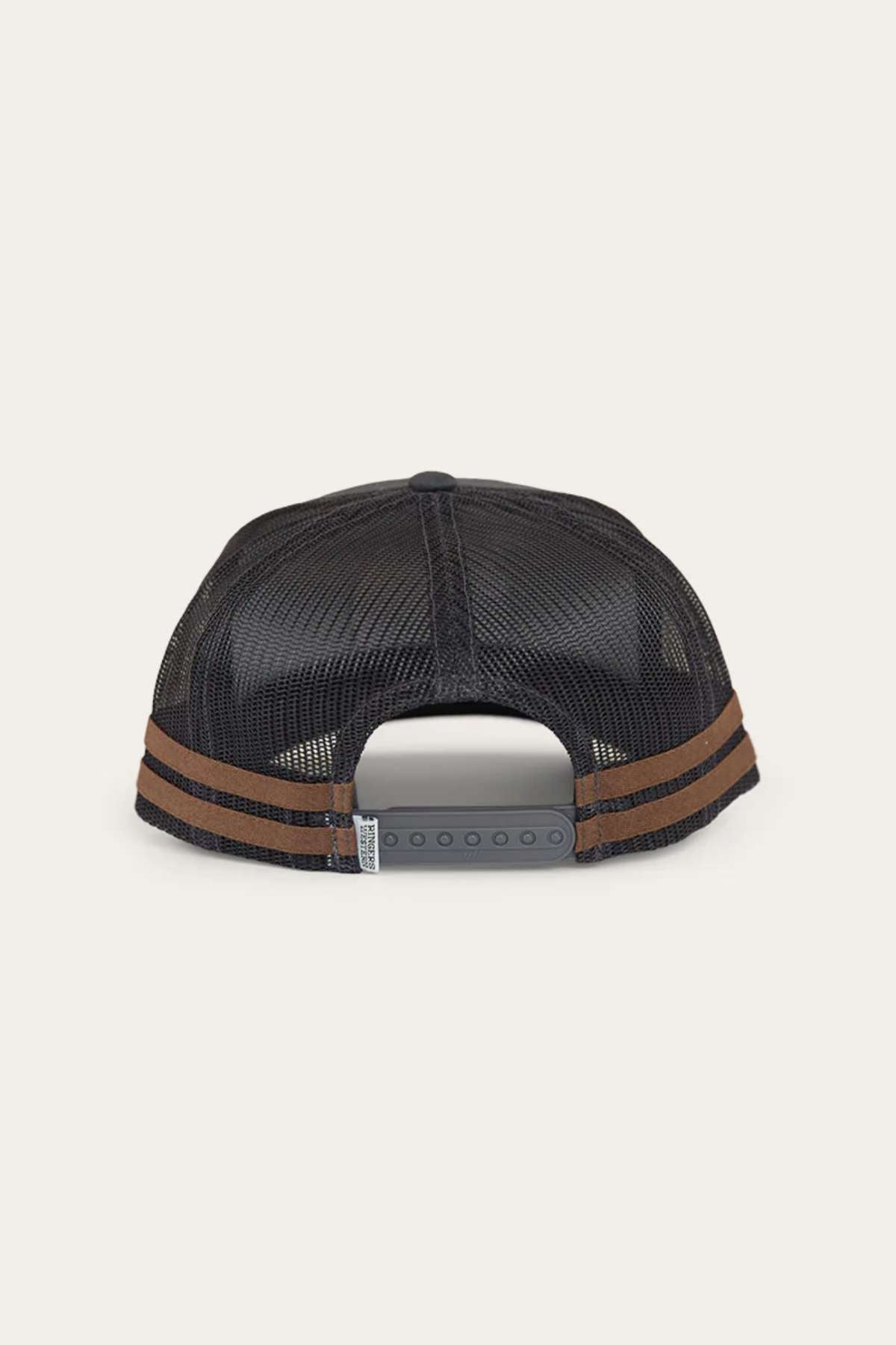 The Ringers Western Pendleton Trucker Cap is a black mesh trucker cap viewed from the back, showcasing an adjustable snapback closure and two brown stripes encircling the base of the crown. This cap offers a breathable design with a structured body.