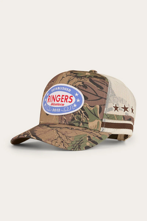 The Ringers Western Shooter Deep Fit Trucker Cap features a camouflage pattern, star and text patch, mesh back, brown striped sides with stars, and an adjustable snapback closure for a perfect fit.