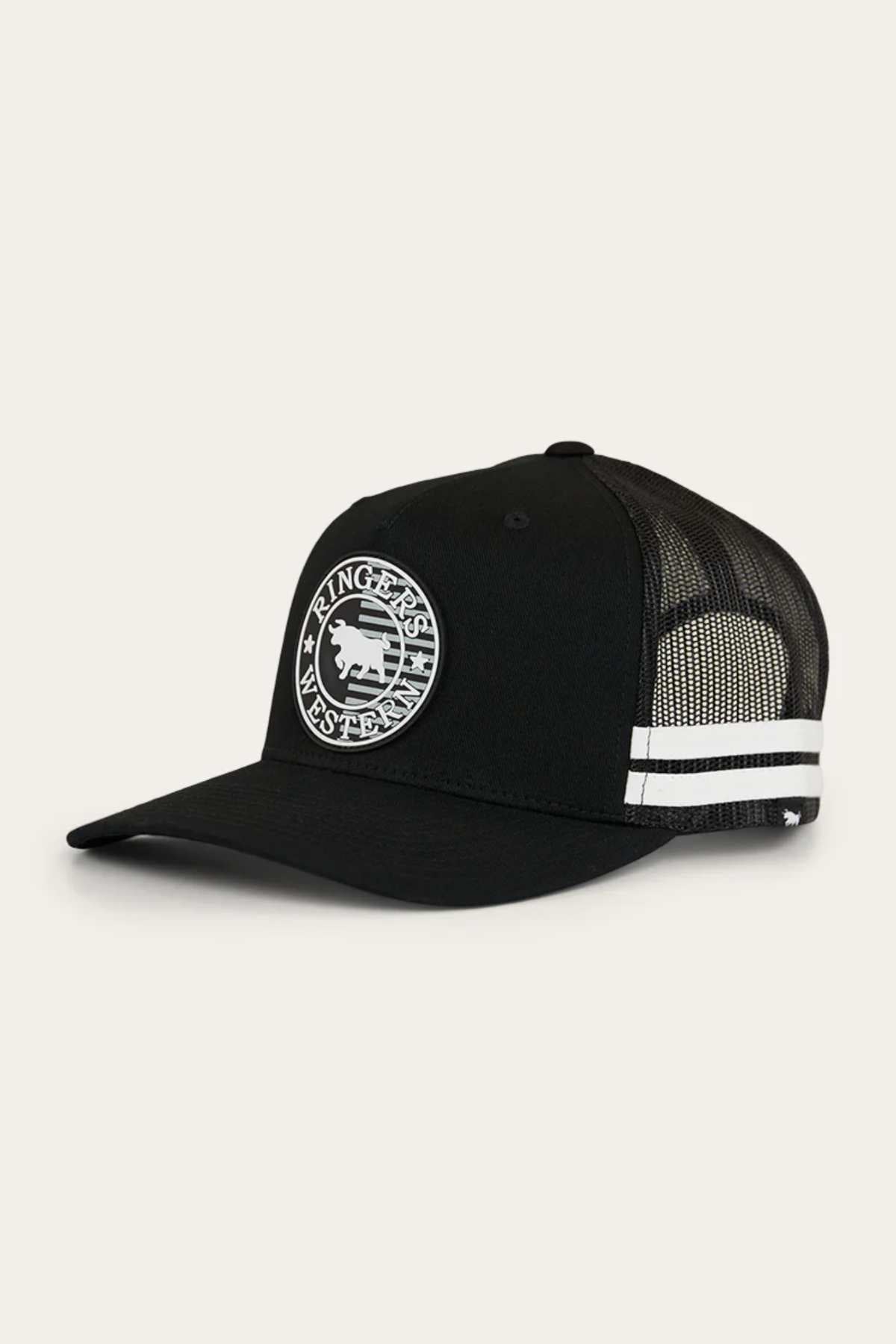 The **Ringers Western Signature Bull Flag Trucker Cap** is a black trucker cap with a curved brim and features a circular logo on the front panel. The logo showcases a stylized image of a bison with text around it. This cap also has white and black stripes on the side, along with a mesh back for ventilation and a snapback closure for an adjustable fit.