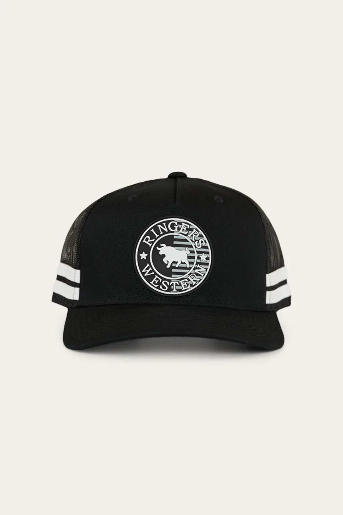 Introducing the Ringers Western Signature Bull Flag Trucker Cap: a black trucker cap showcasing the iconic Ringers Western logo on the front, complete with a circular emblem featuring a bull. Designed for breathability, it has a mesh back, two white stripes flanking the emblem, and an adjustable snapback closure for a perfect fit.