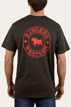 A man wearing the Ringers Western Signature Bull Loose Fit T-Shirt, featuring a large red circular bull logo on the back and made from 100% cotton for all-day comfort.