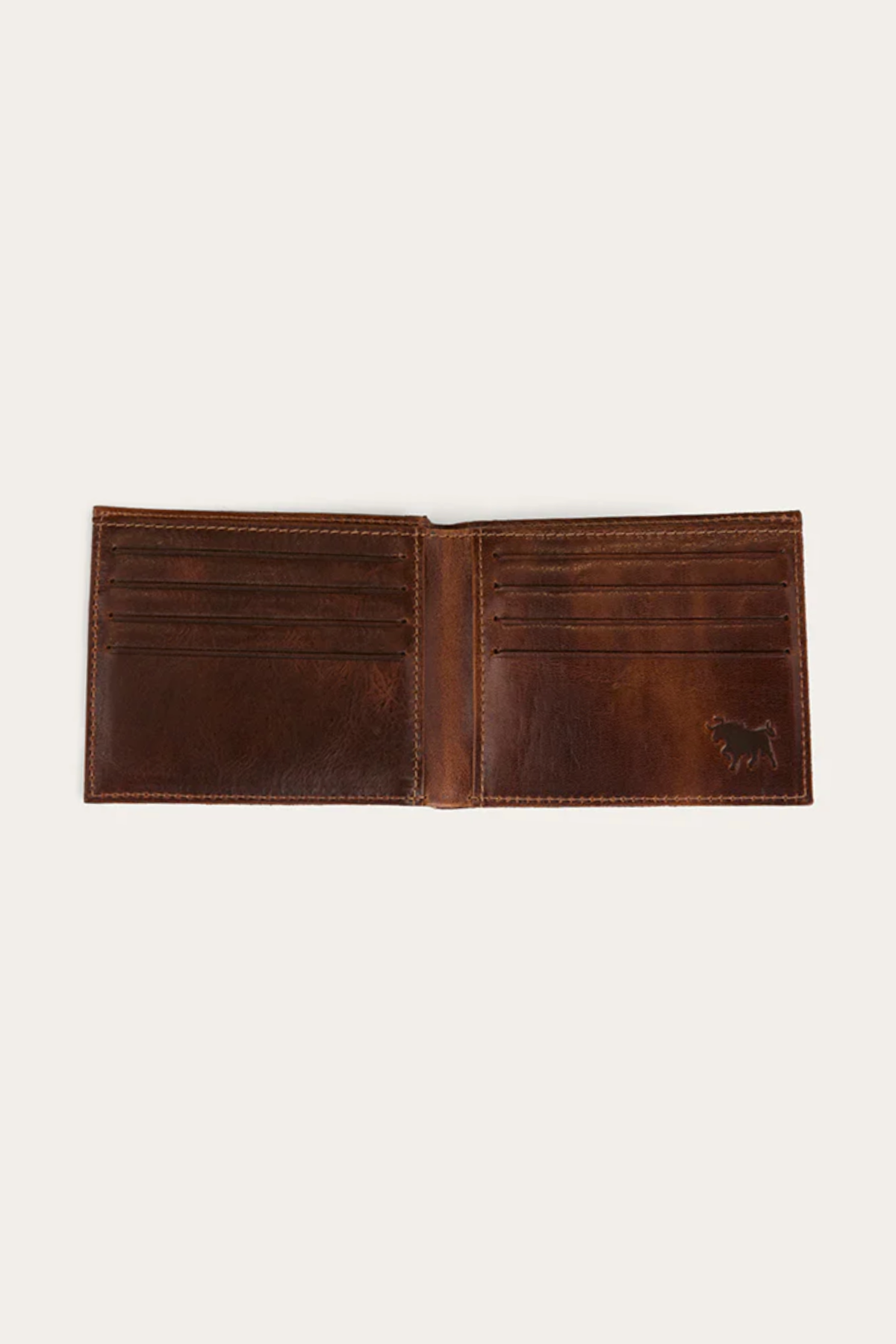 The Ringers Western Toro Midi Wallet is a brown full-grain leather bi-fold with multiple card slots on both sides and a small embossed animal logo—an elegant, slim wallet ideal for everyday use.