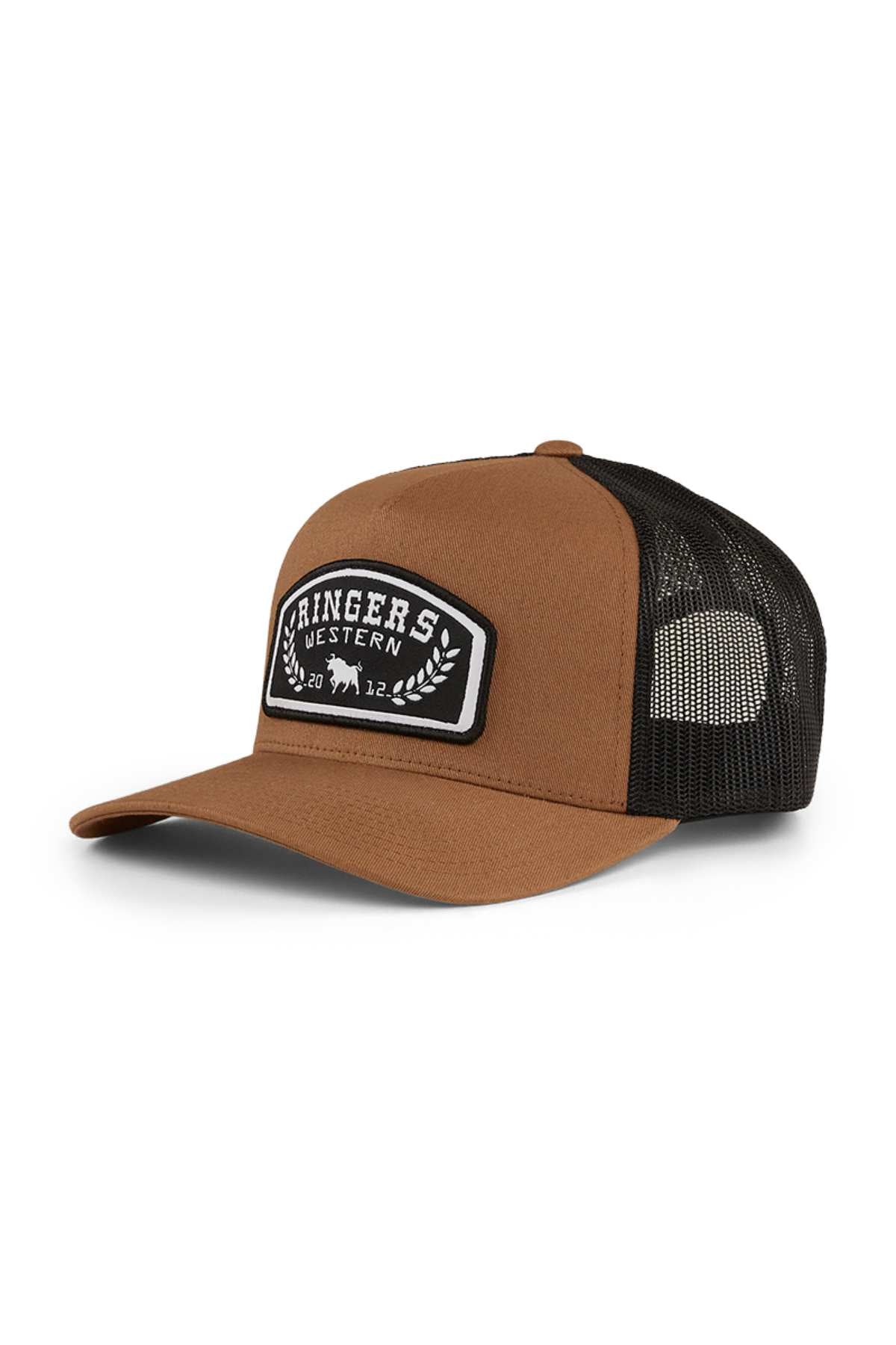 The Ringers Western Wheatbelt Trucker Cap is a brown and black cap with a mesh back, featuring a black and white patch with "Ringers Western," cattle silhouettes, and "2012." Made of durable cotton twill for lasting style.