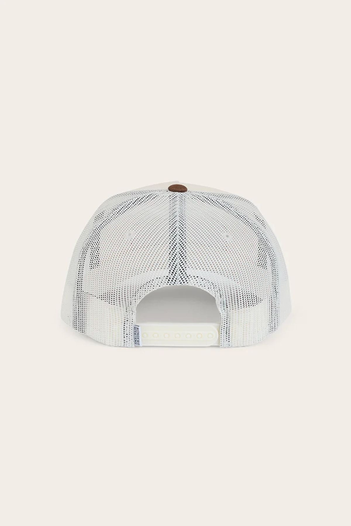The Ringers Western Wheatbelt Trucker Cap is pictured from the back, showing its white mesh design, adjustable snapback strap, and a brown top button, set against a plain light background.