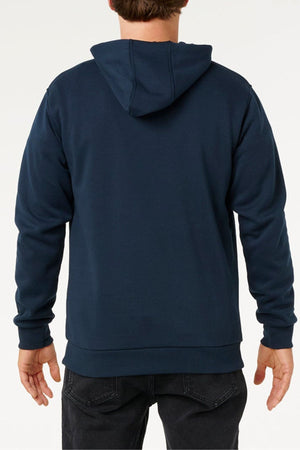 A person is shown from the back, wearing a dark blue Rip Curl Anti Series Search Base Hood and black jeans, standing against a plain light background.