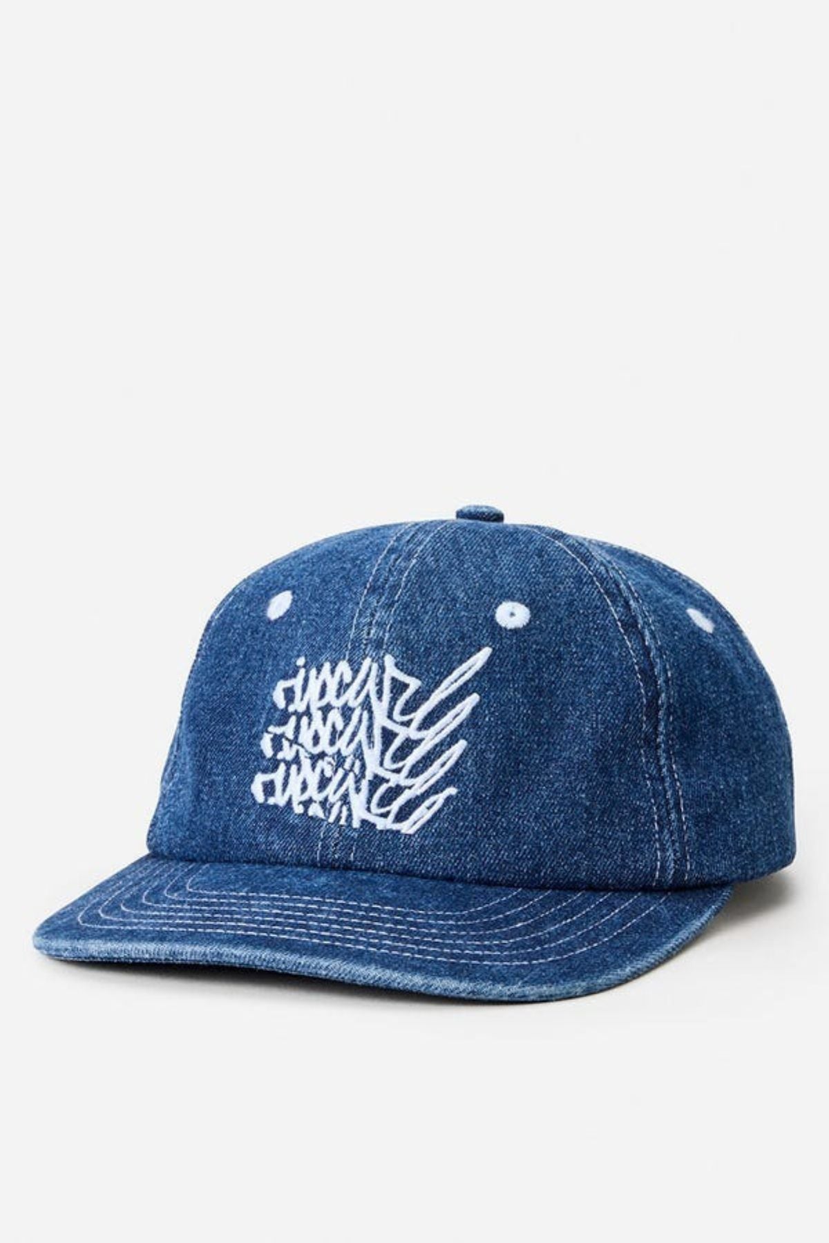 The Rip Curl Archive Denim SB Cap features blue denim fabric and a white embroidered abstract text logo on the front, shown against a plain white background.