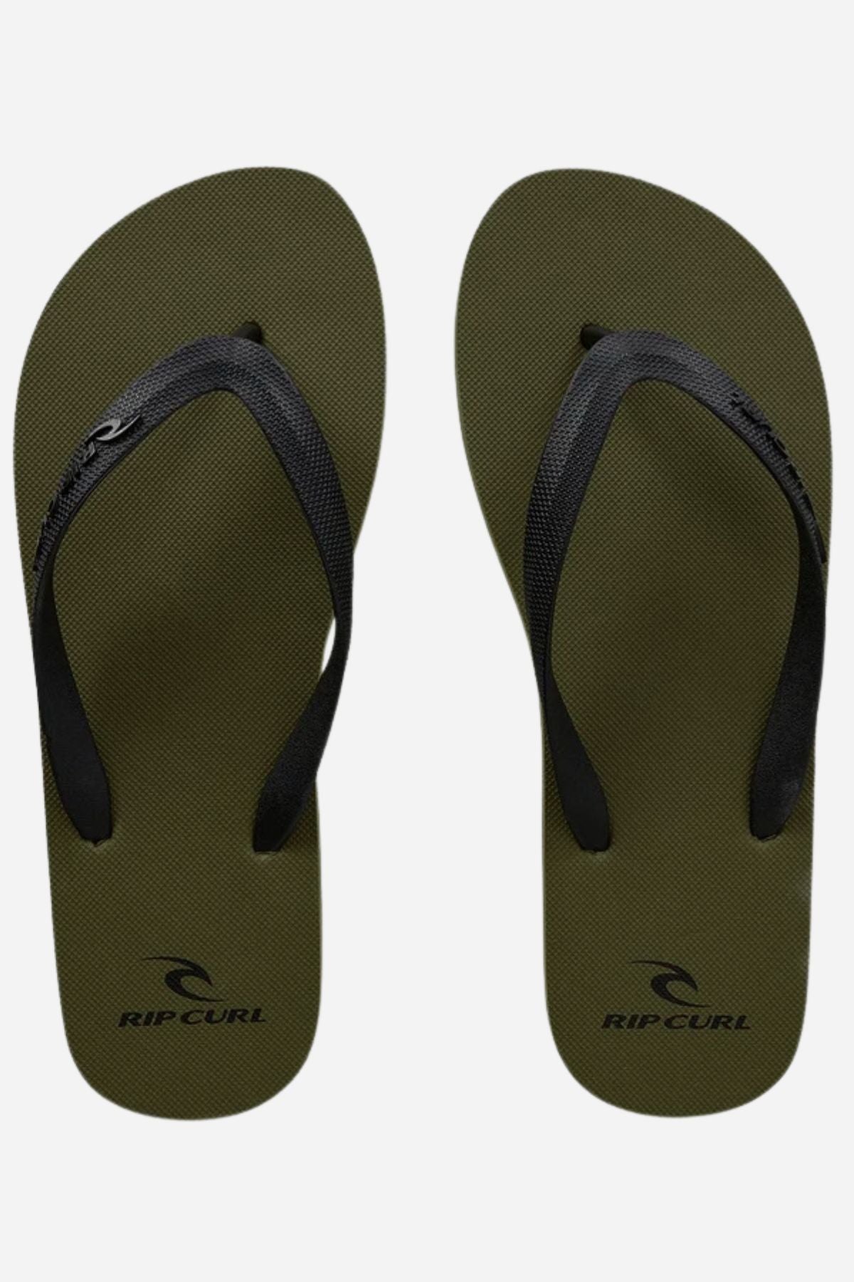 The Rip Curl Brand Logo Bloom Thongs are olive green flip-flops with black straps, made from BLOOM™ algae foam, featuring the "Rip Curl" logo and name near the heel area on each sandal against a white background.