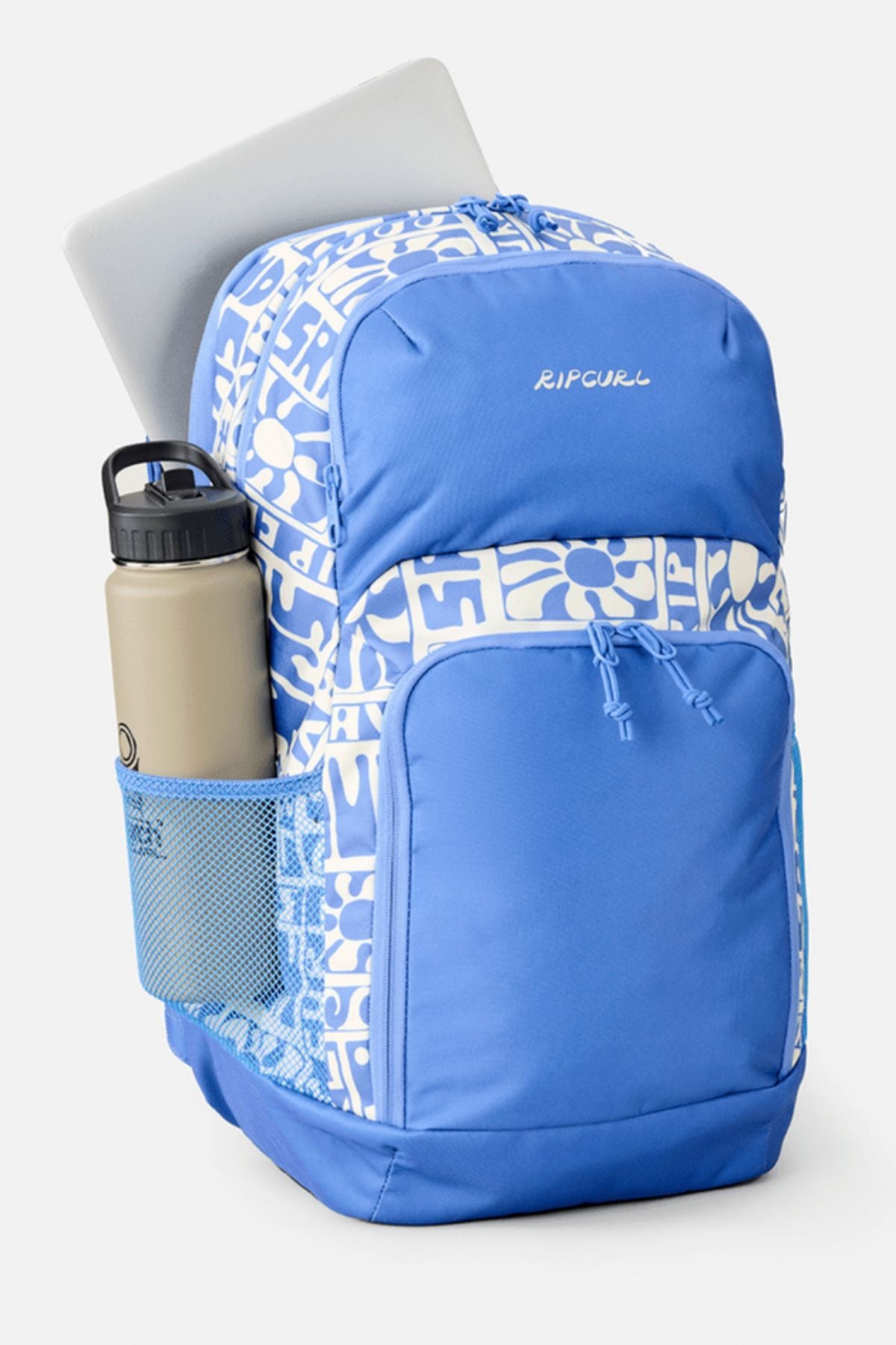 A blue and white Rip Curl Chaser 33L Backpack with a floral design, made from recycled polyester, features a laptop in the main compartment and a beige water bottle in the side mesh pocket, set against a plain white background.