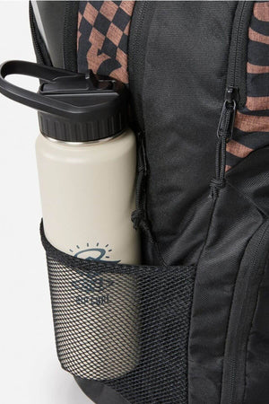 The Rip Curl Chaser 33L Backpack in black features a mesh pocket that holds a beige water bottle with a black cap, and is decorated with a sun and the letter "R." It boasts recycled polyester material and has a black and brown patterned design on the side.