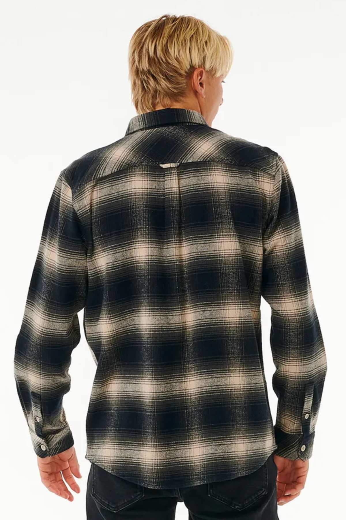 A person with blond hair is shown from the back, wearing a Rip Curl Count Flannel Shirt in black and white against a plain light background.