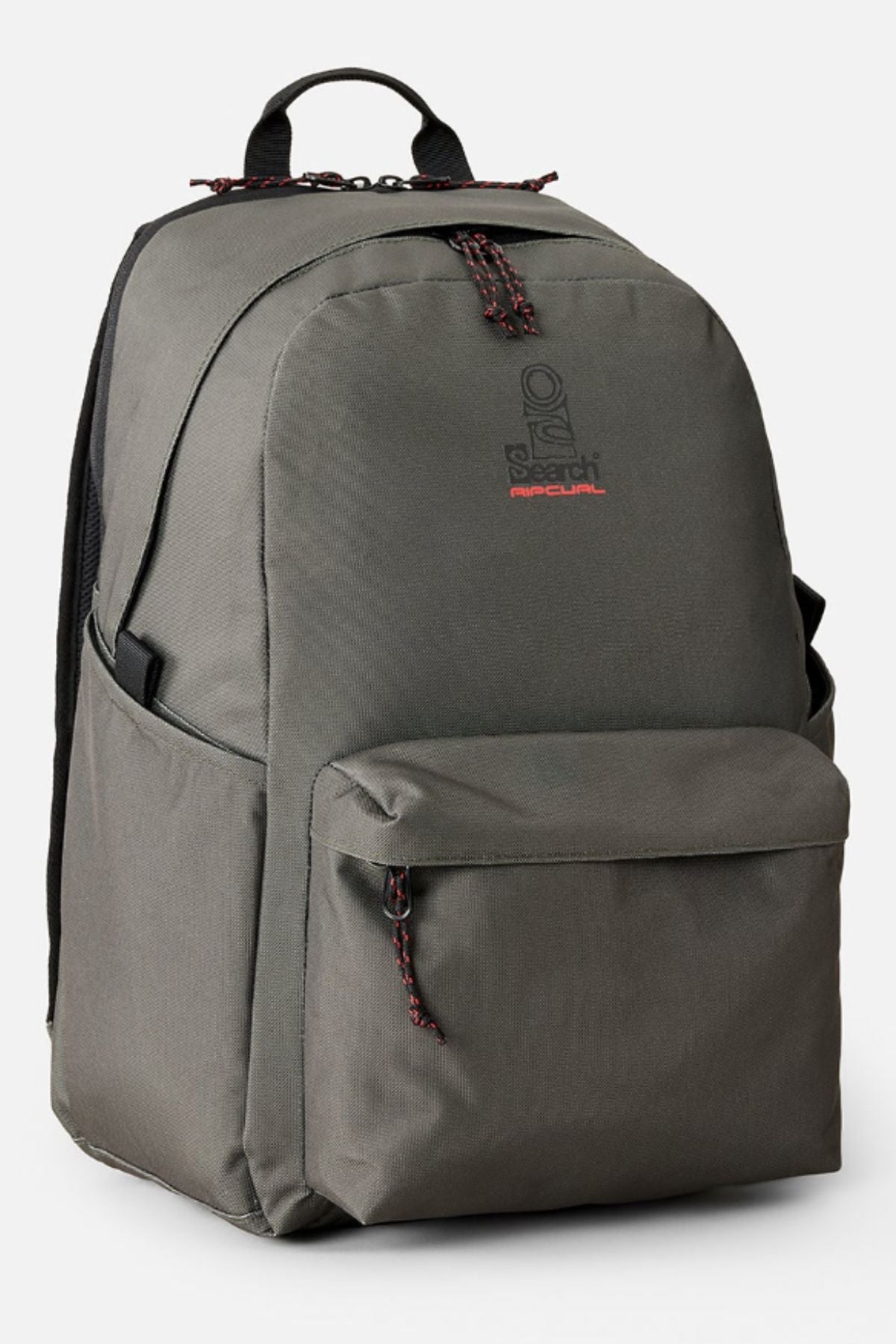 The Rip Curl Crusha 30L Search Backpack is a dark gray travel backpack featuring a front zippered pocket, side pockets, black straps, a top handle, and the "Rip Curl" logo on the front in black and red.