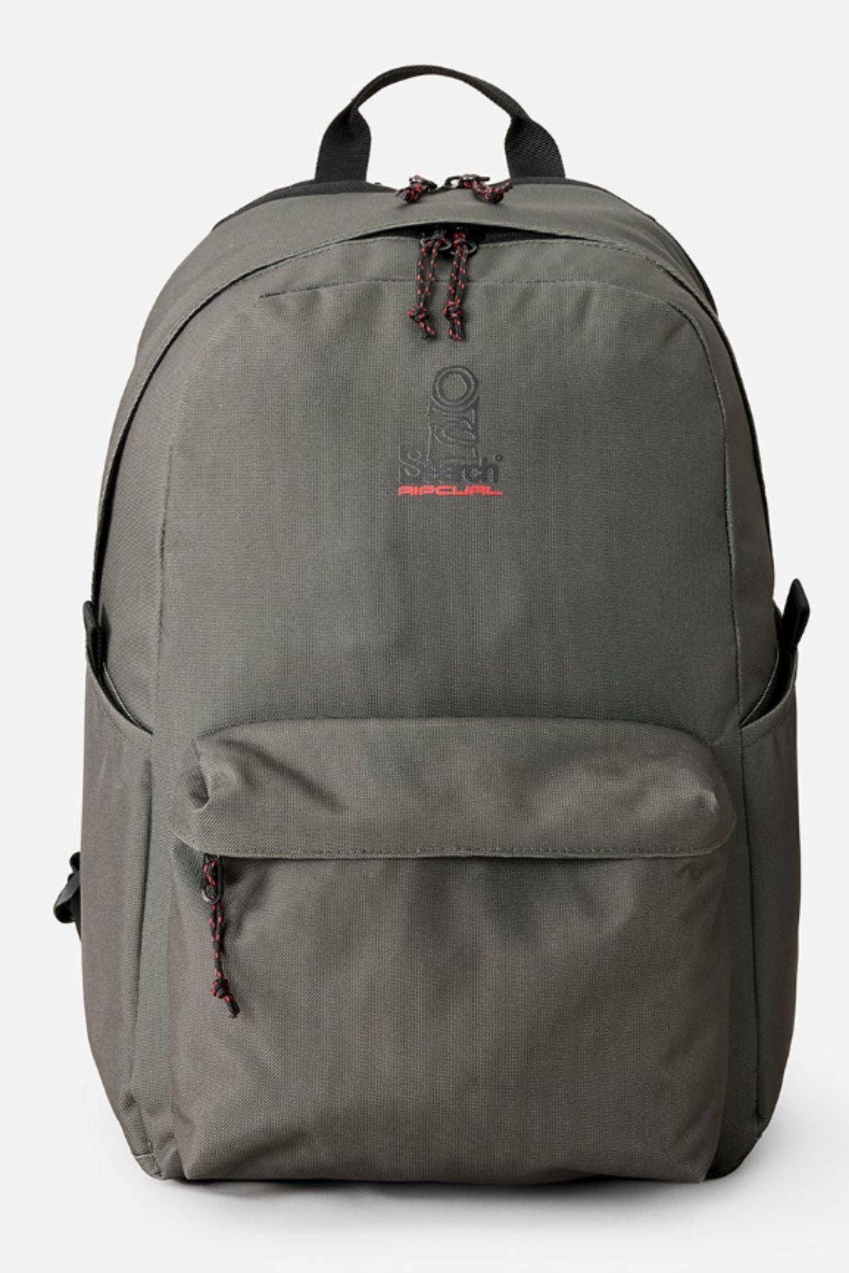 The Rip Curl Crusha 30L Search Backpack features a plain grey design, front zip pocket, top handle, and two side pockets. "Rip Curl" is embroidered in red and white on the upper front, making it ideal for travel.