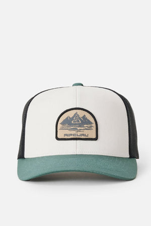 The Rip Curl Custom Curve Trucker has a white cotton twill front, black mesh sides, green brim, and a mountain patch logo with "Rip Curl" at the center.