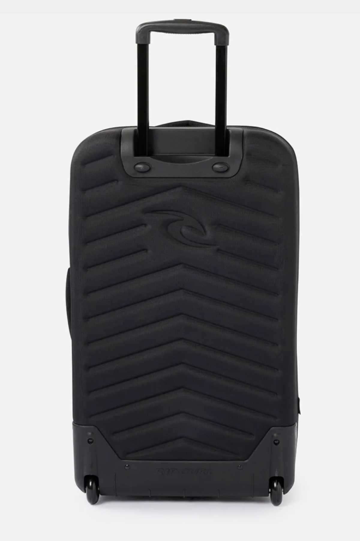 The Rip Curl F-Light Global 100L Icons Travel Bag is depicted standing upright, showcasing its chevron-patterned black hard-shell surface. Prominently displayed in the center is the small Rip Curl F-Light surfboard logo. The suitcase's bottom corners are reinforced, and it has two wheels at the base along with an extended retractable handle, making it an ideal 100L travel companion.