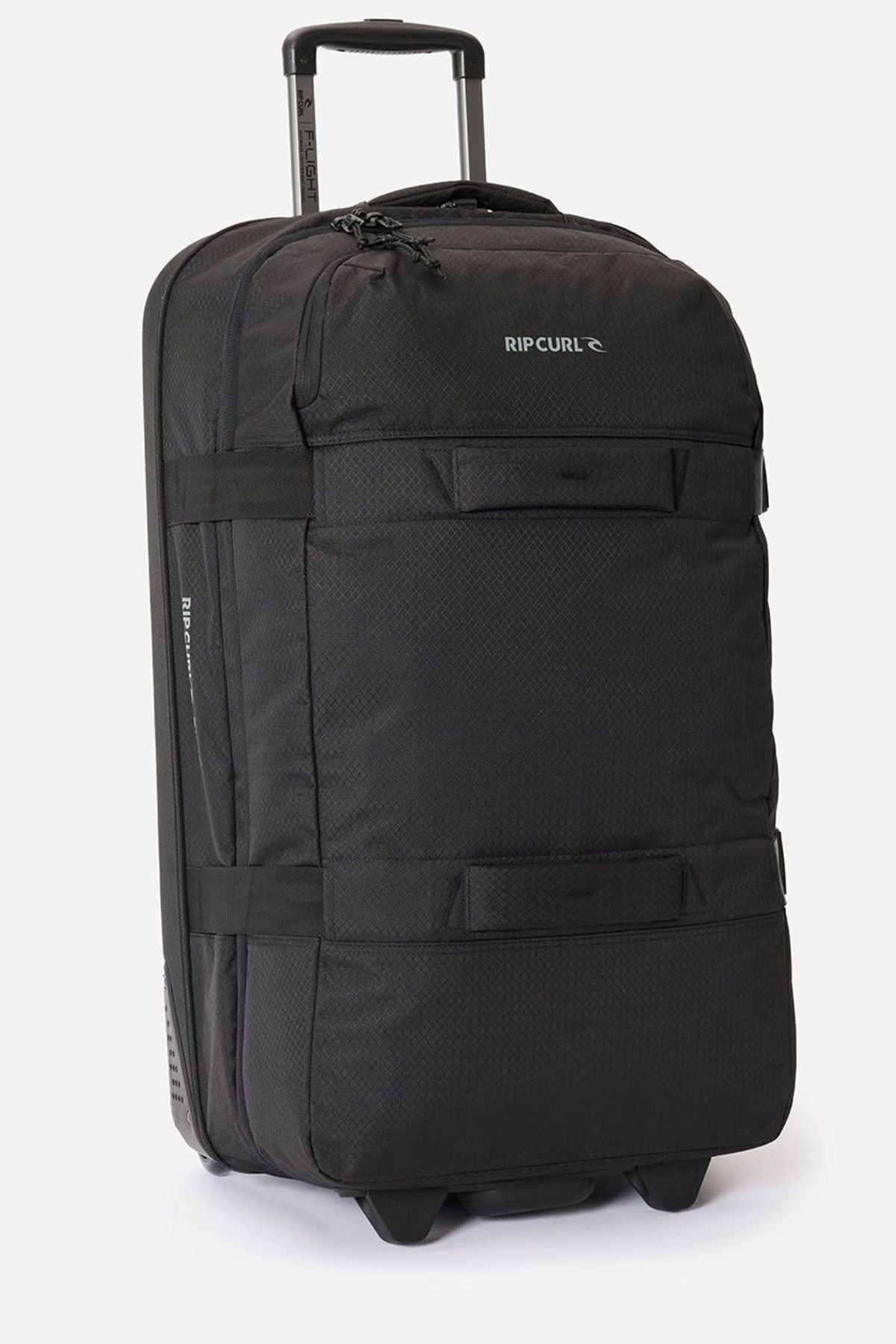 The Rip Curl F-Light Global 100L is a large black check-in roller bag featuring a retractable handle, two front pockets, sturdy side straps, and an AirTag sleeve, shown upright against a plain white background.