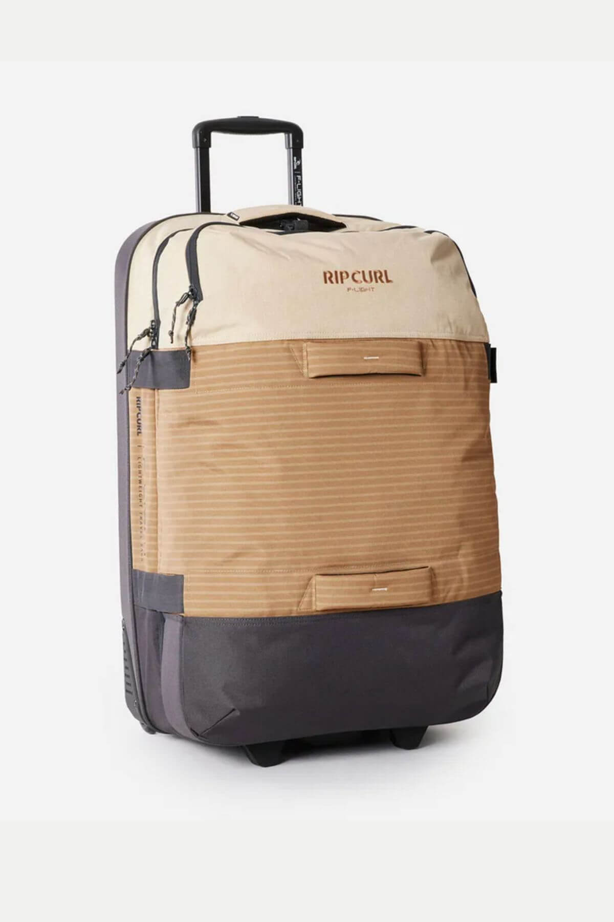 The Rip Curl F-Light Global 110L Icons Travel Bag in beige, tan, and gray features wheels, a retractable handle, front pockets, zippers, and compression straps. It stands upright against a plain white background.