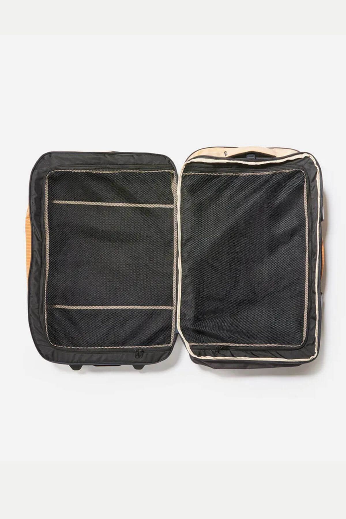 The Rip Curl F-Light Global 110L Icons Travel Bag is shown open and empty, with beige trim, two mesh-covered compartments, compression straps, and a side handle, lying flat on a white background.