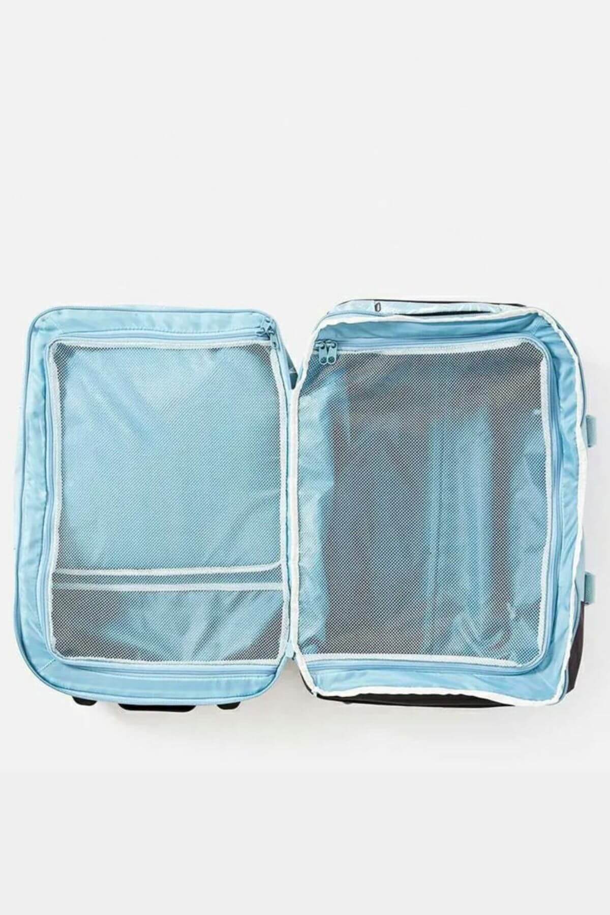 An open, empty light blue Rip Curl F-Light Transit 50L Sessions Travel Bag with mesh zippered compartments is shown from above on a plain white background.