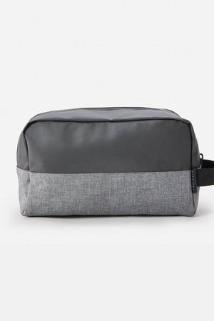 The Rip Curl Groom Toiletry Icons Of Surf bag, with a dark gray top, light gray bottom, and small black side handle, is shown against a plain light background—ideal for stylish travel organization.