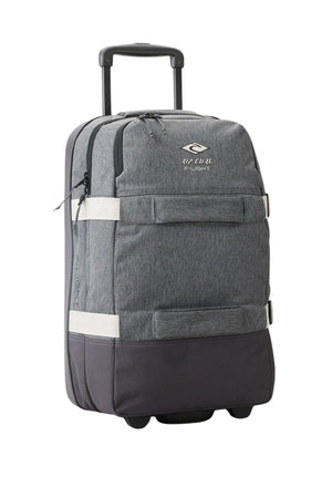 The Rip Curl Jupiter 80L Classic Surf Travel Bag is a lightweight gray wheeled suitcase featuring a retractable handle and front pocket. Its durable fabric is adorned with the Rip Curl logo, emphasizing an eco-friendly approach. Its compact design makes it perfect for surf travel, allowing you to pack efficiently while riding the waves.