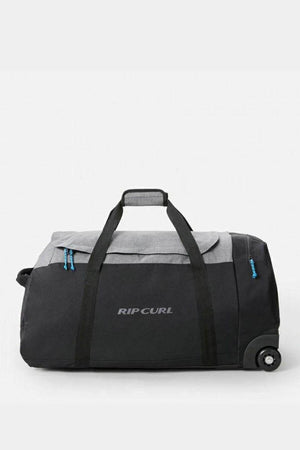 The Rip Curl Jupiter 80L IOS Bag is a spacious black and gray rolling duffle with the brand's logo on the side. It features two wheels, a sturdy handle for easy transport, blue zippers, and is made from durable water-resistant ripstop material.