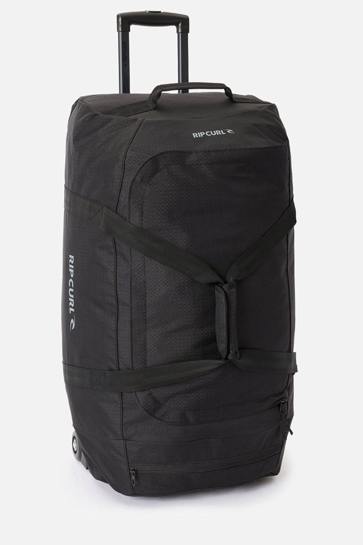 The Rip Curl Jupiter 80L travel bag, large and black with a telescopic handle, side straps, and durable inline skate wheels, stands upright against a plain white background.