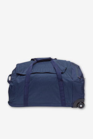 A large navy blue Rip Curl Jupiter 80L Mixed Travel Bag with handles and wheels is positioned against a white background. Made from lightweight recycled polyester, it boasts a spacious zippered main compartment and an exterior flap pocket.