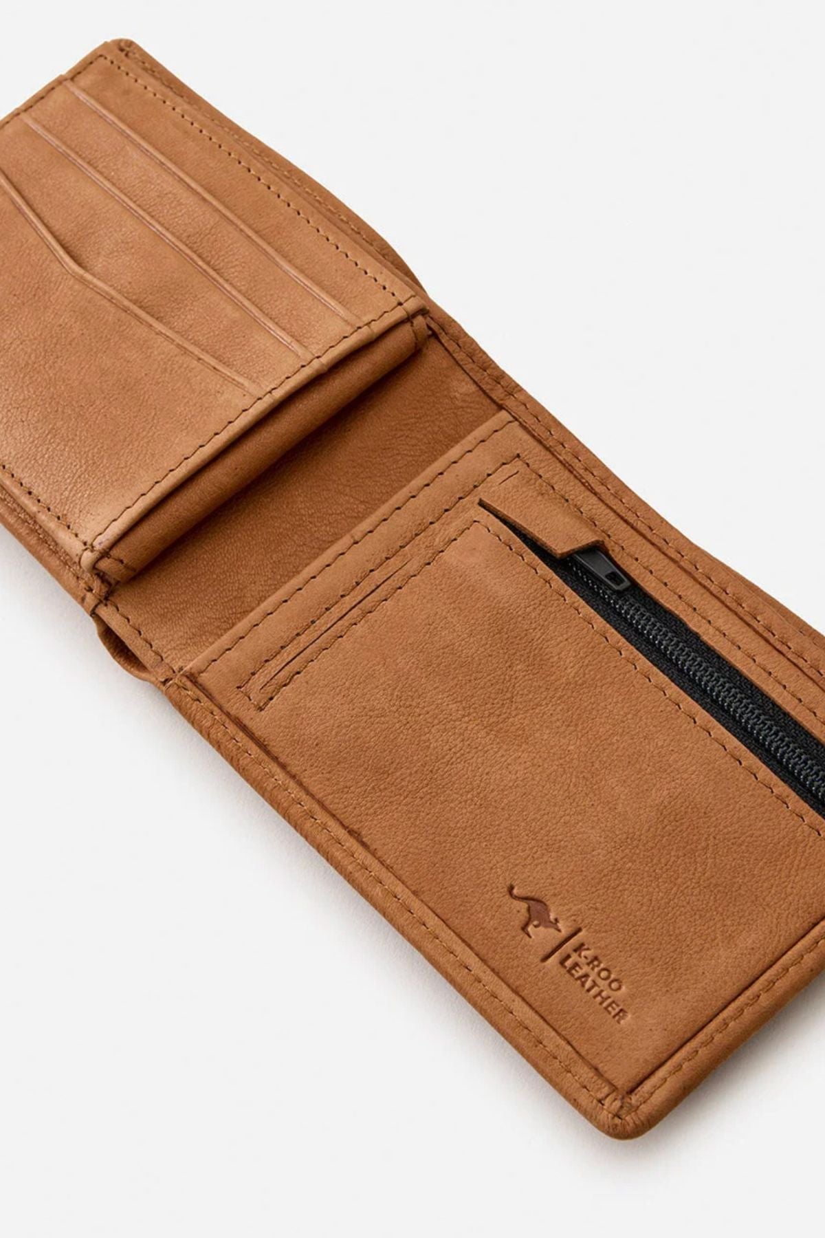 The Rip Curl K-Roo RFID Slim Wallet, made from tan kangaroo leather, is open to show multiple card slots, a zippered pocket, and a stamped "Kangaroo Leather" logo. The wallet is displayed against a plain white background.