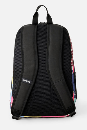The Rip Curl Ozone 2.0 30L Backpack is black with padded shoulder straps, a mesh back panel, “Rip Curl” branding on the straps, and colorful pink, blue, and yellow accents along the edges.