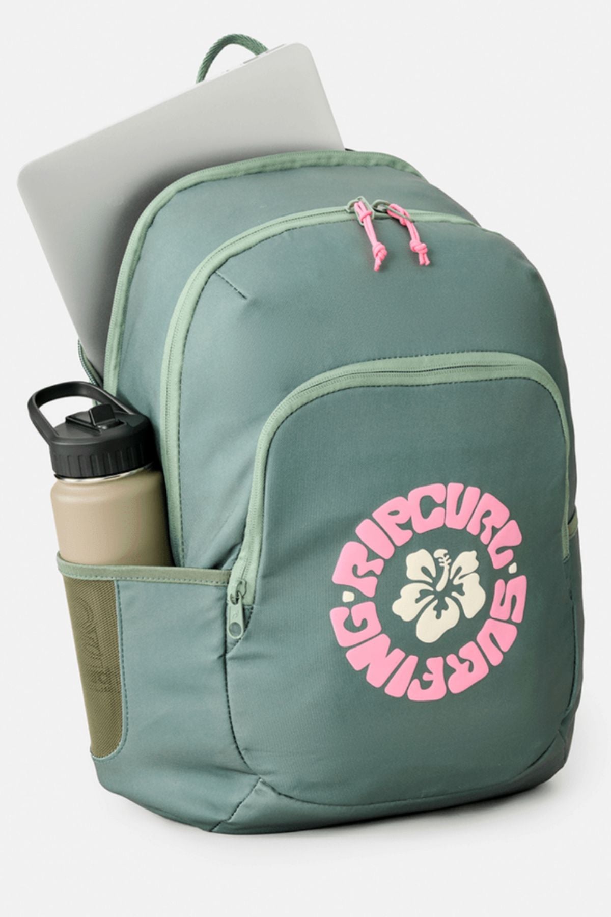 A green Rip Curl Ozone 2.0 30L Backpack with a pink logo and floral design, shown with a silver laptop in the main compartment and a beige water bottle in the side pocket, set against a plain light background.