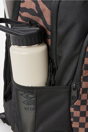 A close-up of the Rip Curl Ozone 2.0 30L Backpack, featuring black and brown checkered stripes, organiser pockets, and a beige water bottle in a black mesh side pocket.