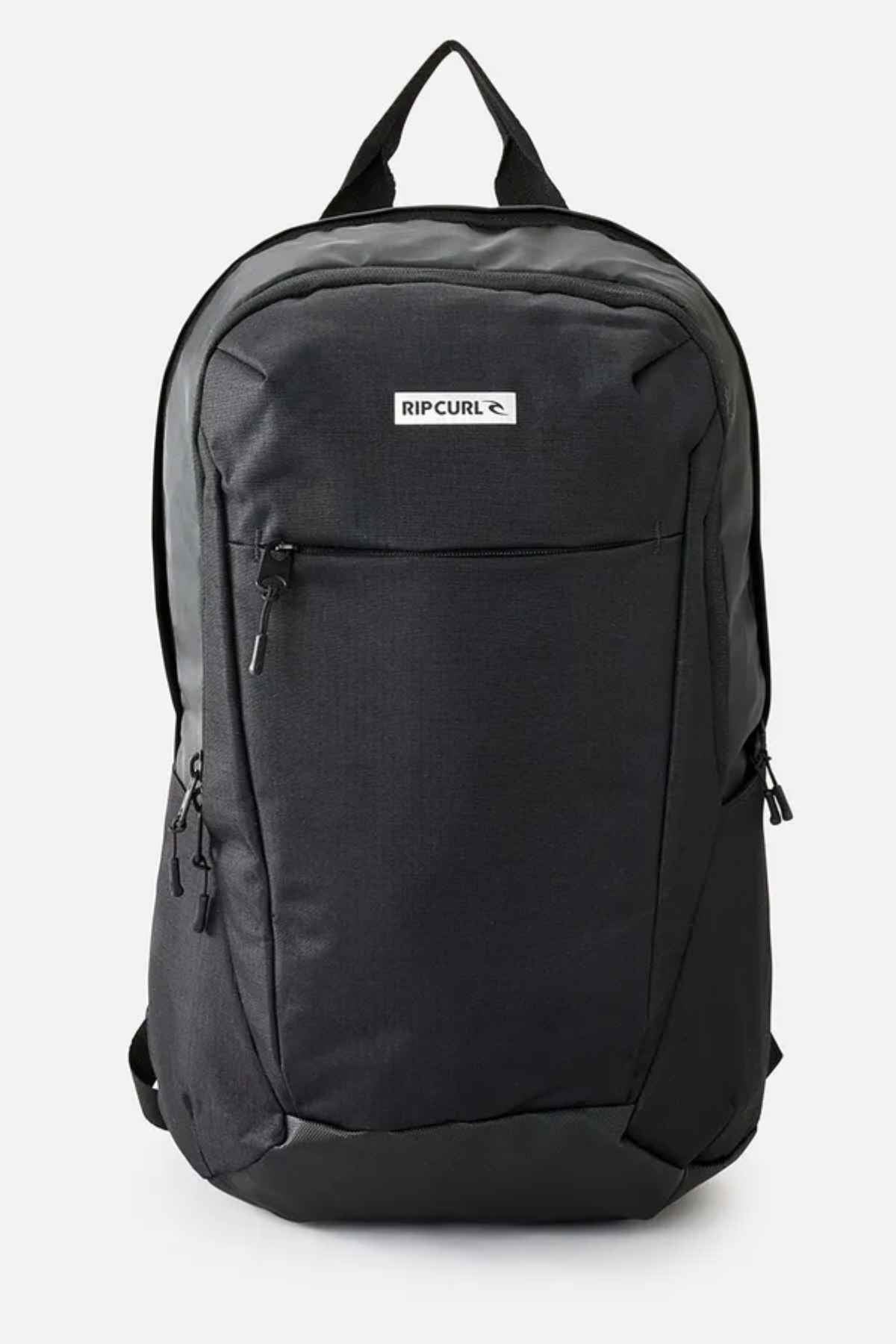 The Rip Curl Overtime 30L Icons Backpack in black is an ideal choice for the eco-conscious adventurer, featuring a front zip pocket, side pockets, and a top handle. Made from recycled polyester, the brand logo is prominently displayed on the front against a straightforward design on a plain white background.