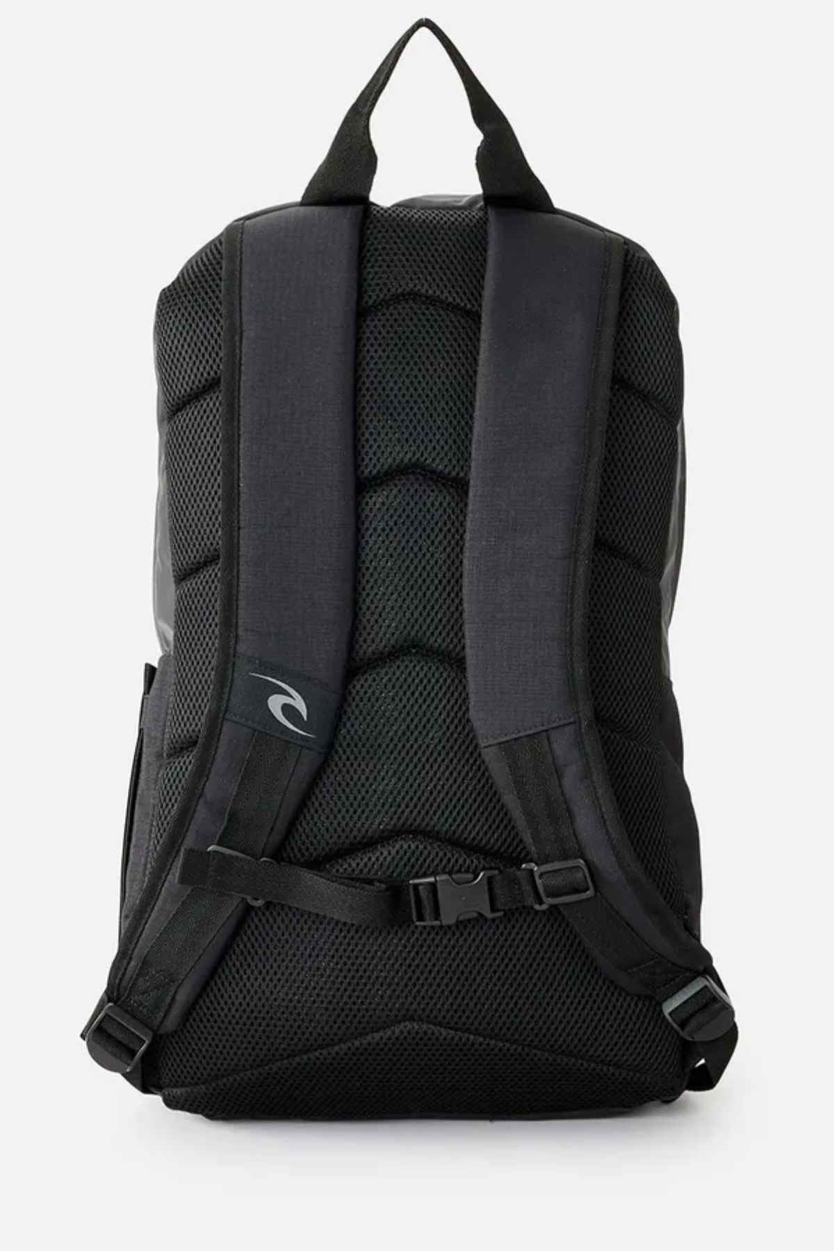 The Rip Curl Overtime 30L Icons Backpack, designed for the eco-conscious adventurer, showcases a sleek black design made from recycled polyester. It includes padded straps, mesh back detailing, and an adjustable chest strap, with a small logo near the center set against a plain white background.