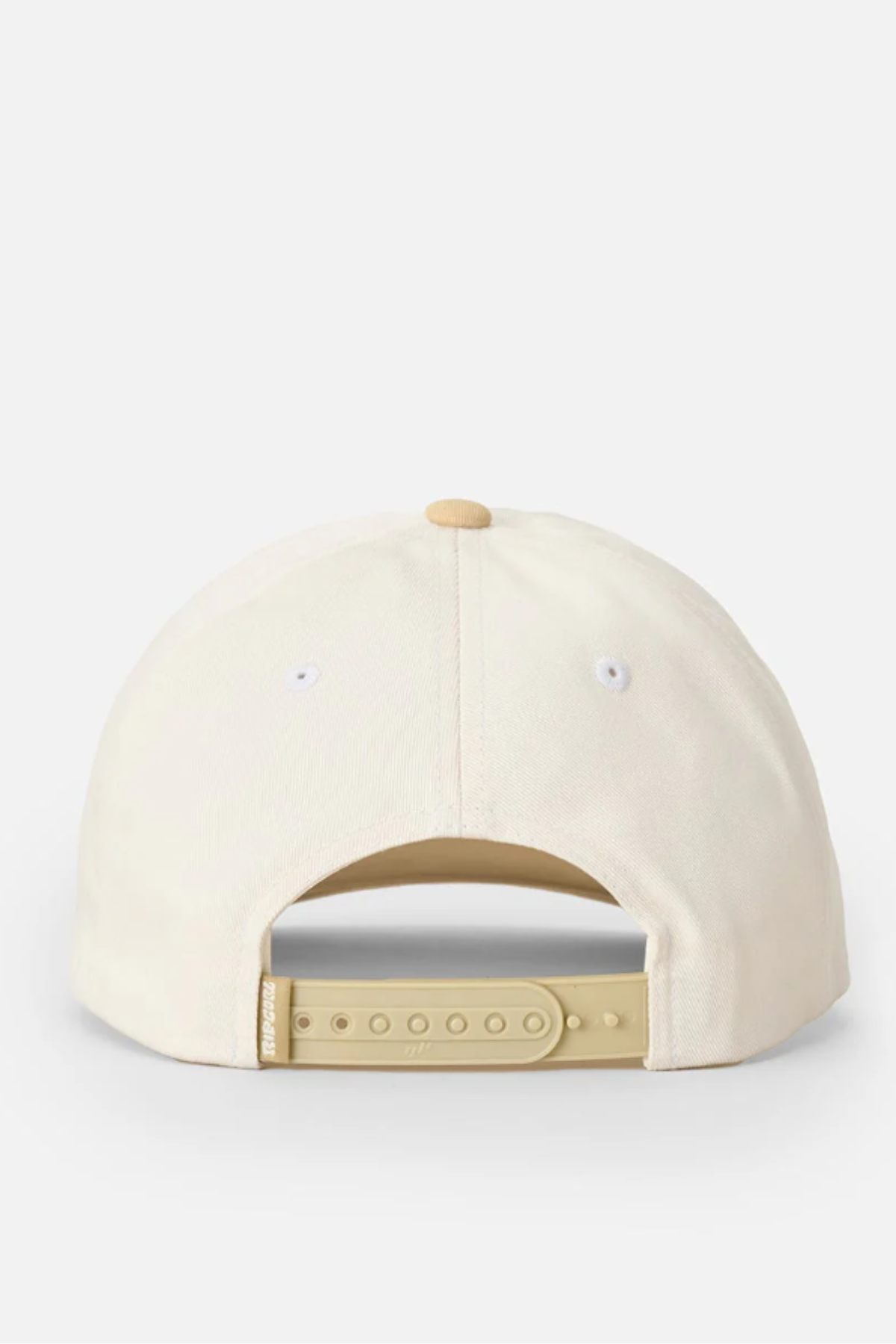 The Rip Curl Pacific Rinse SB Cap is a cream, unstructured cap with a beige adjustable snap closure at the back and a small top button—ideal for casual beach days.