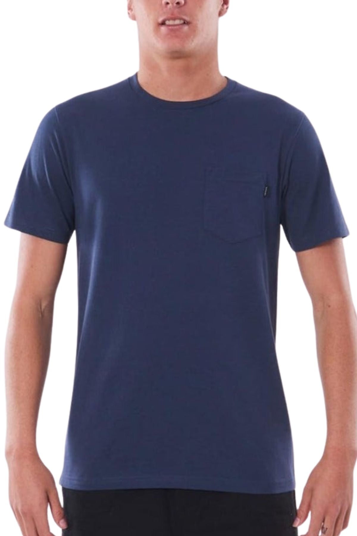 Someone stands against a white background wearing the Rip Curl Plain Pocket Tee, a classic navy blue 100% cotton shirt featuring a small pocket on the left chest—an essential addition to any wardrobe.