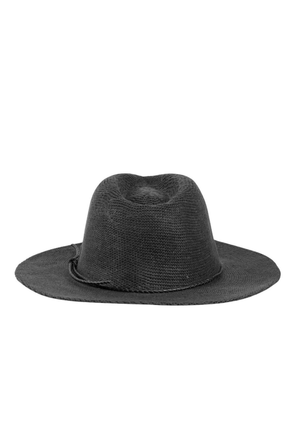 A black fedora with a wide, floppy brim and creased crown, resembling the Rip Curl Spice Temple Knit Panama Hat, is displayed on a white background.
