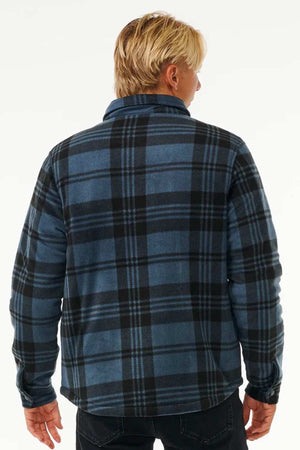 A person with blonde hair is wearing a Rip Curl Tofino Polar Fleece Jacket made from recycled poly fleece, viewed from the back against a plain background.