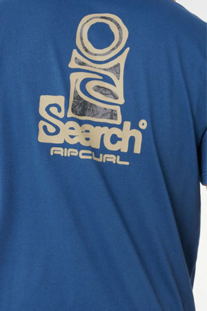A close-up of the back of the blue Rip Curl Vaporcool Search Stack Tee, featuring a large tan "Rip Curl Search" logo with abstract graphic elements.