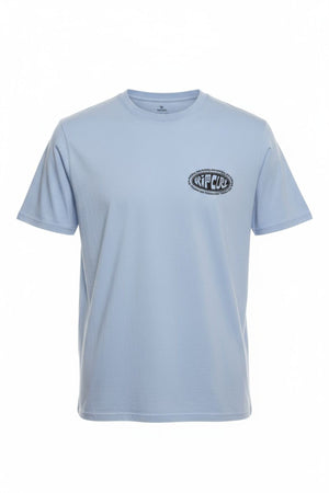The Rip Curl Raw Energy De Oval Tee is a light blue, 100% cotton short-sleeve crew neck with a small black and white "RIP CURL" logo on the left chest, shown on a plain white background.