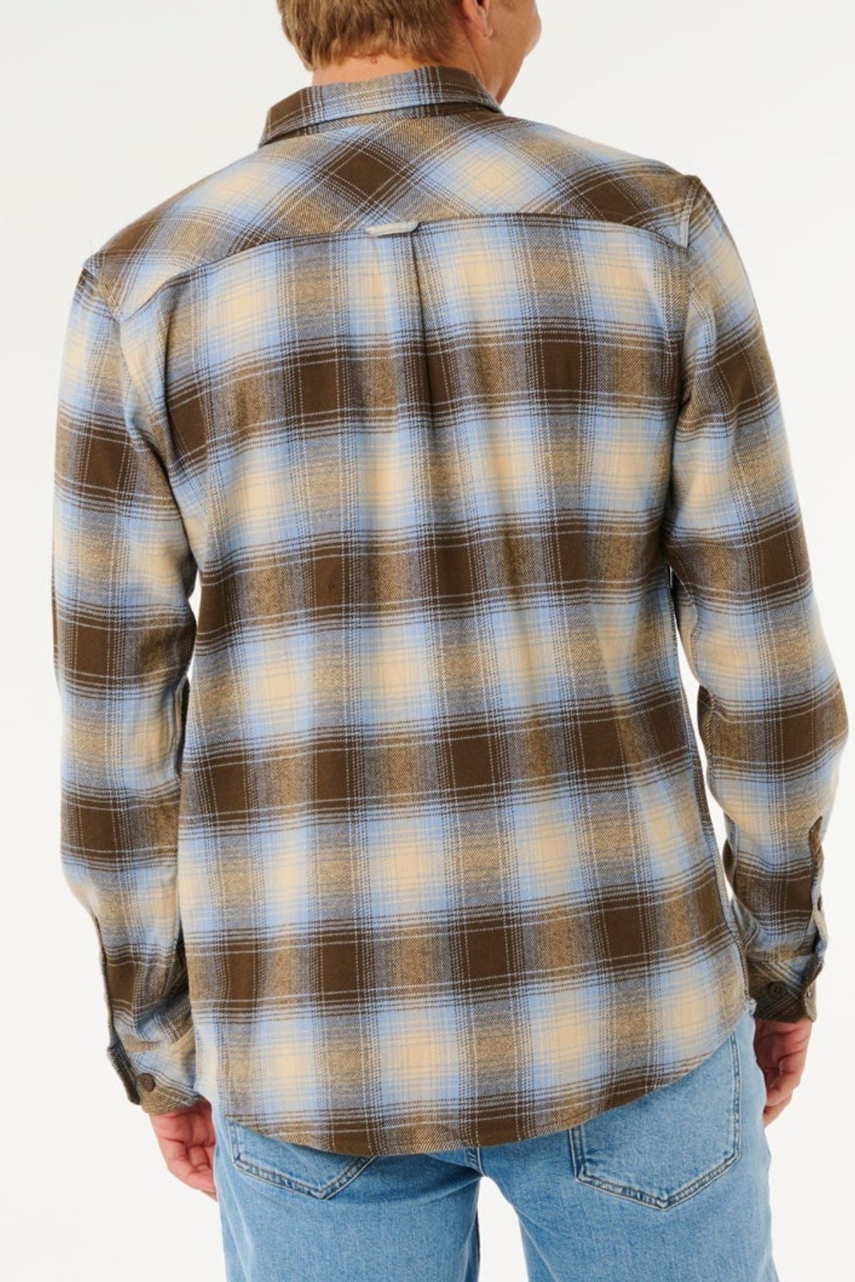 A person seen from behind wears the Rip Curl Count Flannel Shirt in brown, blue, and yellow plaid heavy brushed fabric with light blue jeans, set against a plain white background.