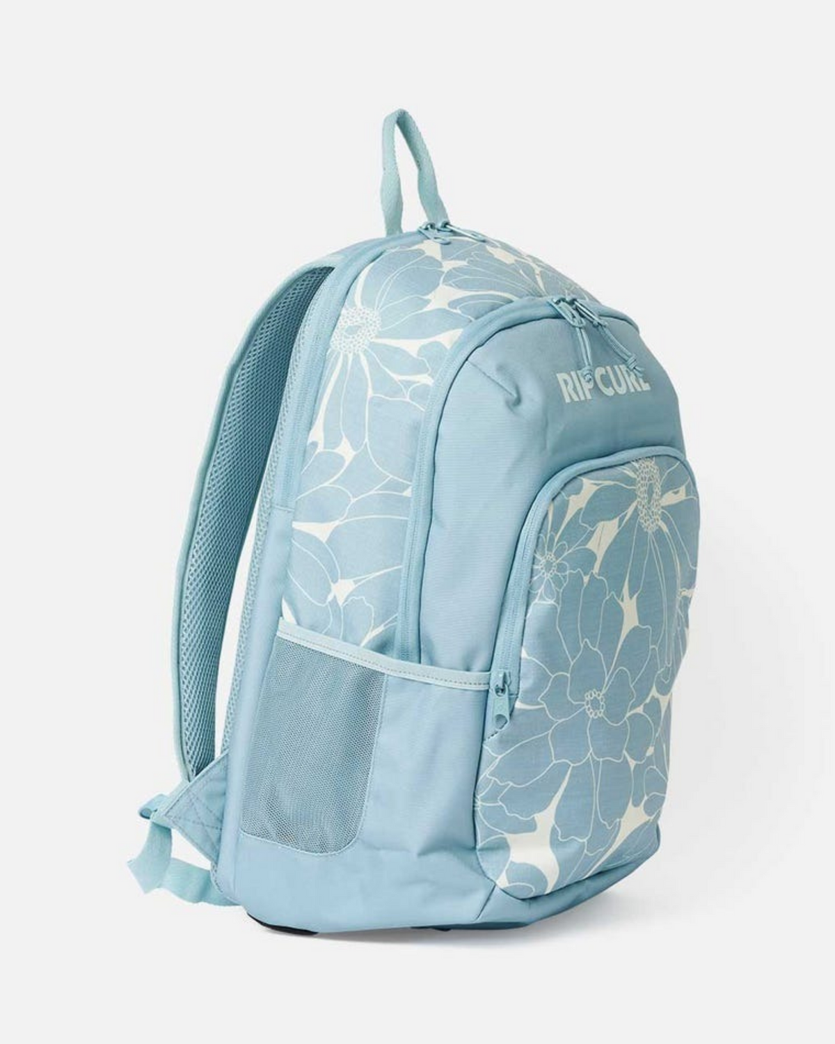 The Rip Curl Ozone 2.0 30L Backpack features a light blue design with bold white floral prints, mesh side pocket, padded shoulder straps, front zip pocket, laptop compartment, top front "RIP CURL" logo, and is crafted from recycled polyester.