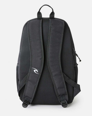 The Rip Curl Ozone 30L School Backpack is shown from the back, featuring two padded mesh shoulder straps, a ventilated back panel, a top handle, and eco-friendly recycled polyester construction for durability.