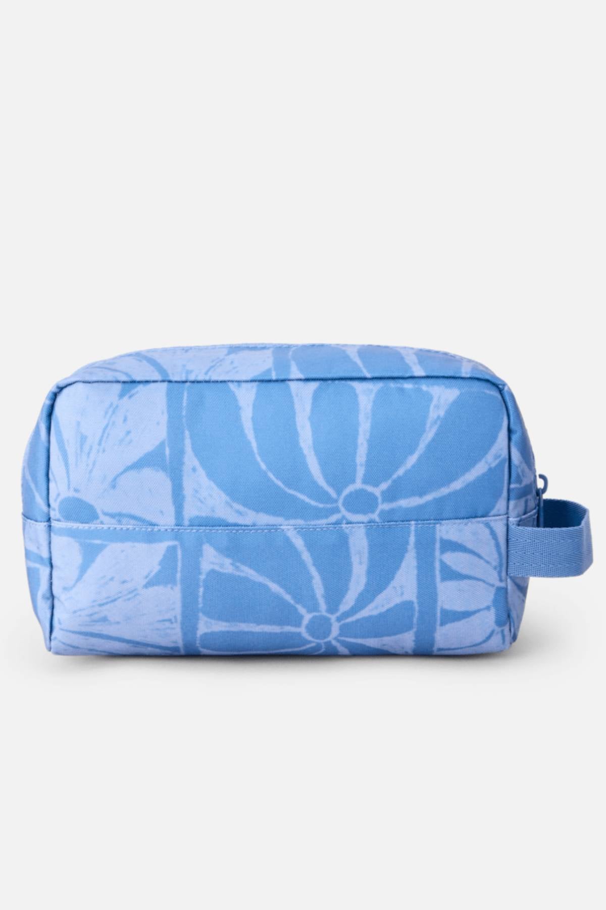 The Rip Curl Mixed Toiletry Bag is a rectangular blue bag with a zipper and side loop, featuring a light blue abstract floral pattern.