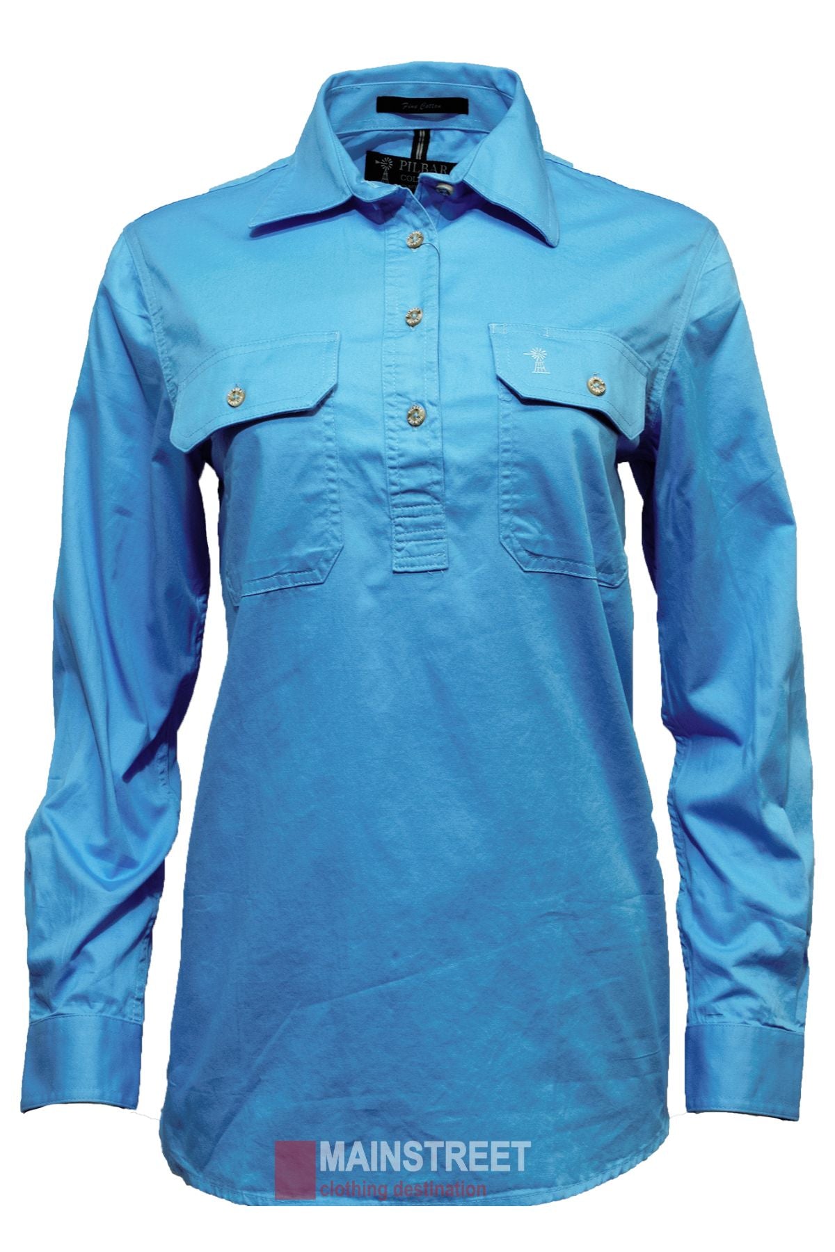 The Pilbara Ladies Long Sleeve Closed Front Shirt is a blue button-up women's work shirt with two chest pockets, buttoned cuffs, and a collar. Made from peachy cotton for comfort and style. Displayed on white with "MAINSTREET" branding below.